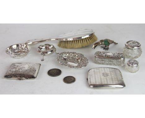 A George V silver cigarette case, Birmingham 1913; another cigarette case; an embossed silver dish, a bun shaped salt; a silv