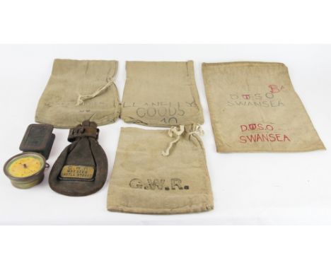 A Great Western Railway cast iron paperweight; a G.W.R leather pouch with brass plate for Maesteg Castle Street; four canvas 