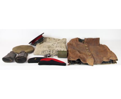 A World War II Royal Engineers leather waistcoat; a pair of gators - one dated 1940 with military arrow; an officers cap; two