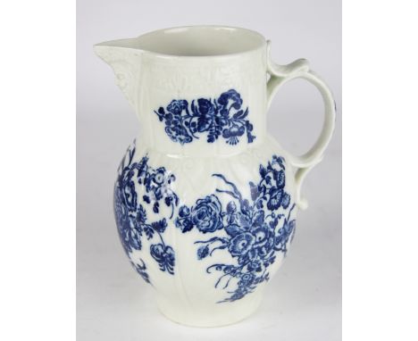 A Worcester porcelain cabbage leaf mask jug, decorated with floral sprays, 19cm