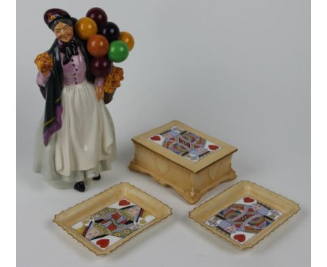 A Royal Doulton figure - Biddy Penny Farthing, HN1843, 22.cm, a Doulton Burslem playing card box and cover and two trays (5)