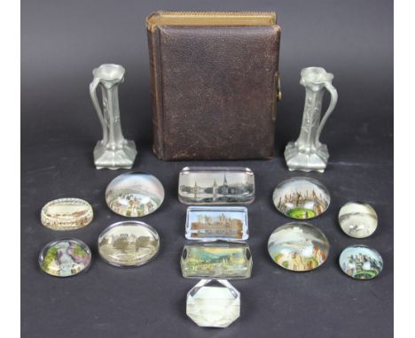 A pair of French Art Nouveau pewter ewers; twelve Victorian and later glass paper weights decorated with tourist views; a pho