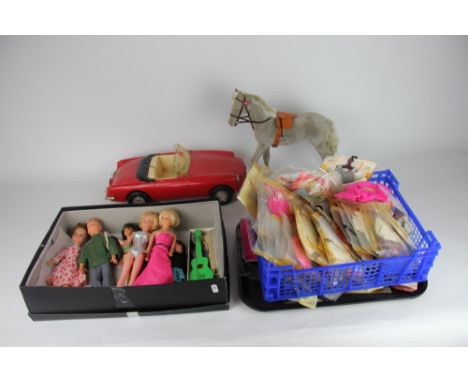 A collection of Cindy dolls, Patch and other clothes and accessories, to include an MG sports car; grey pony, guitar in box, 