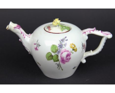 An 18th century Meissen porcelain teapot and cover, painted witH floral sprigs (restored cover and spout, handle repaired), 1