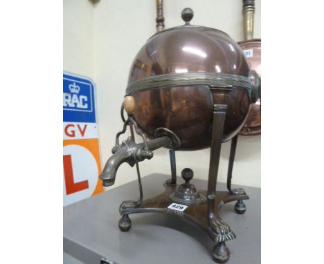 Victorian copper samovar of globular form on lion paw feet and ring handles 
