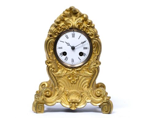 A 19TH CENTURY FRENCH ORMOLU MANTLE CLOCK the case with acanthus leaf scrolls and scallop shell decoration, the enamelled dia