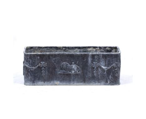 A RECTANGULAR LEAD PLANTER OR TROUGH decorated with swags and a lion, 73cm wide x 22cm deep x 25cm high