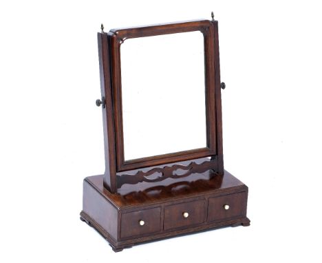 A GEORGE III MAHOGANY BOX BASE DRESSING TABLE SWING MIRROR on three drawers with ogee bracket feet, 40cm wide x 23cm deep x 5