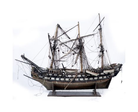 AN ANTIQUE MODEL DEPICTING A THREE MASTED SHIP OF THE LINE with two rows of gun ports and with lion figurehead, 132cm wide x 