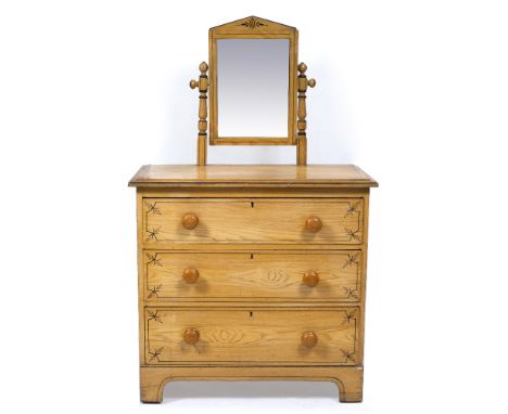 A LATE VICTORIAN SCUMBLE DECORATED PINE DRESSING CHEST with hinged mirror above, three long drawers with turned knob handles,