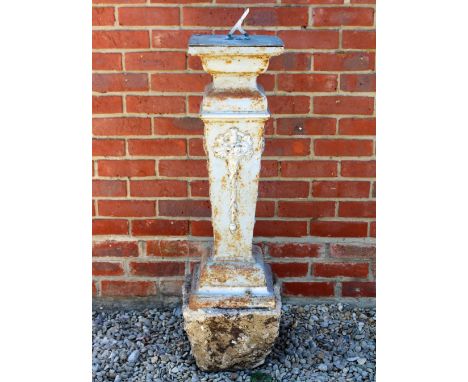 A CAST IRON SUNDIAL BASE with cast aluminium sundial plate and gnomen, 27cm wide x 81cm high
