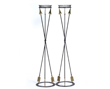A PAIR OF EMPIRE STYLE WROUGHT IRON TORCHERES  with arrow supports and ring bases, 34.5cm diameter x 141cm high (2)