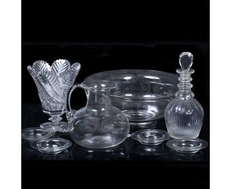 A 19TH CENTURY GLASS WASH BASIN AND JUG with folded rim and looping handle, wash basin 37.5cm x 14cm, jug 19cm together with 