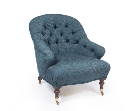 A DARK GREEN MATERIAL BUTTON BACK UPHOLSTERED ARMCHAIR with turned front legs and casters, 69cm wide x 80cm high