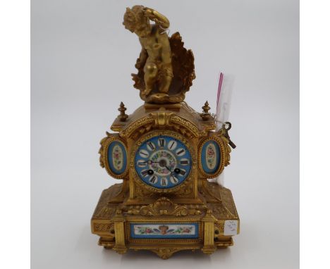 19th century figural gilt mantel clock with blue enamelled porcelain face and panels, decorated with floral sprays, striking 