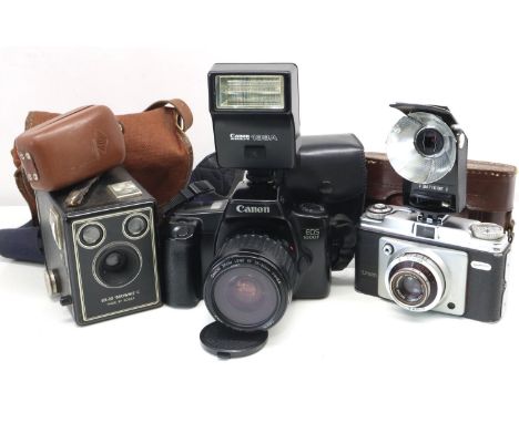 Collection of film cameras including Canon EOS 1000F with 35 to 80mm lens. UK P&amp;P Group 3 (£30+VAT for the first lot and 