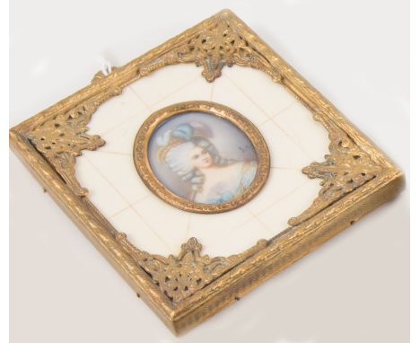 Oval portrait miniature, 38mm x 30mm, lady with ringlets and plumes in her hat, signed, mounted in a simualted ivory and gilt