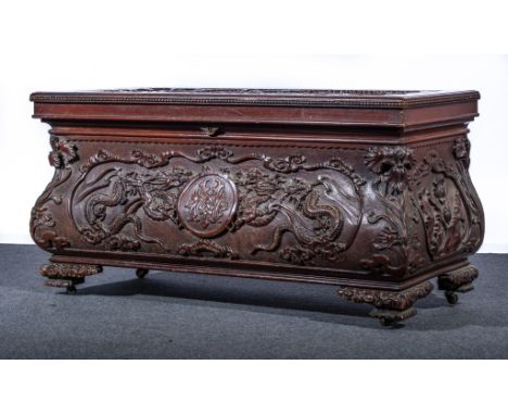 Anglo Chinese carved and stained wood chest, rectangular top with a panel with a three toed dragon, moulded edge, the base of