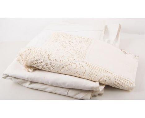 Two boxes of vintage table linen and lace, including a vintage dress.