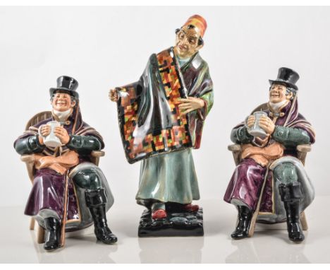 Three Royal Doulton figures,  two models of "The Coachman" HN2282, "The Carpet Seller" HN1464, (3)