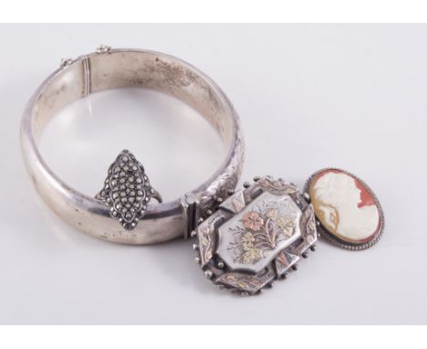 A collection of silver and white metal jewellery, a silver engraved half hinged bangle, Victorian brooches, small cameo brooc
