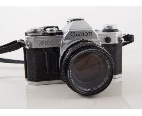 Canon AO1 SLR camera with case, with other  vintage camers, tripod, flashes, some with cases, one box.