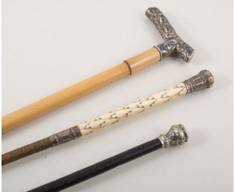 Three small whips, a 42cm woven leather whip with white metal mounts and leather thong, a Victorian 70cm woven leather whip w