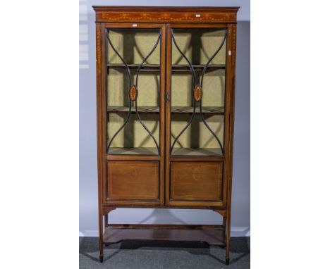 Edwardian mahogany china cabinet, rectangular top, moulded cornice, glazed and panelled doors enclosing three shelves, square