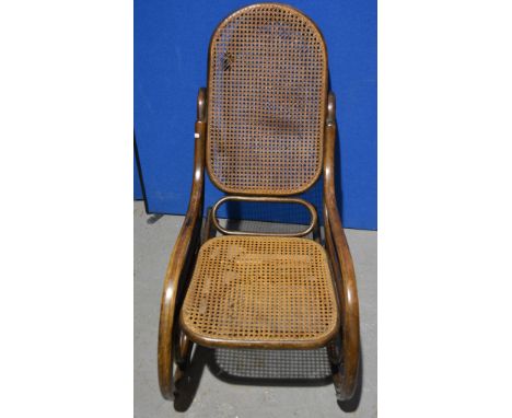 Thonet bentwood and rattan rocking chair, applied paper label, together with a rocking gout stool (2).