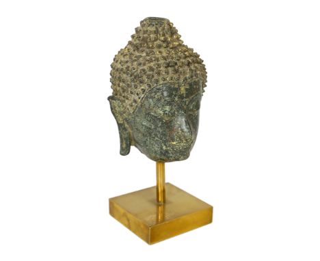 * A bronze head of Buddha, Northern Thailand, 14th century, on a stand, 13cm, (20cm overall)Provenance: Spink & Son Ltd, Lond