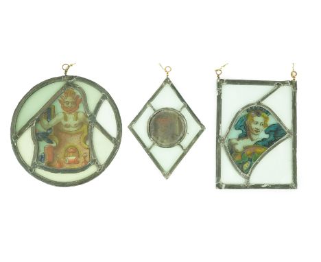 Three stained glass fragment panels, 17th century and later, one depicting a female bust, another of a Pan like figure emergi