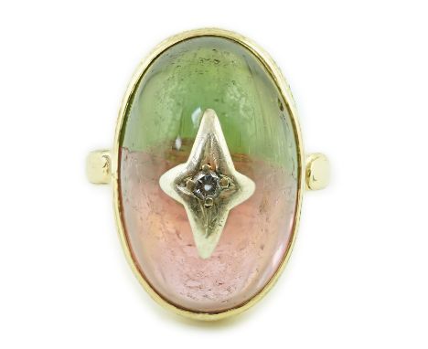 A Victorian 18ct gold and cabochon watermelon tourmaline set dress ring, with engraved setting and stone with central diamond