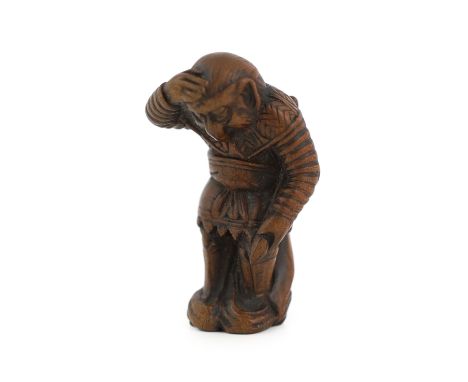 * A Japanese wood netsuke of Son Goku (Sun Wukong) flying on his cloud somersault, early 19th century, signed Sentsu, 4.4cmPr