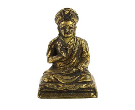 A Chinese miniature cast bronze figure of Teacher (Lama) Changkya Rolpai Dorje, 18th/19th century, with engraved robes, 4cm h
