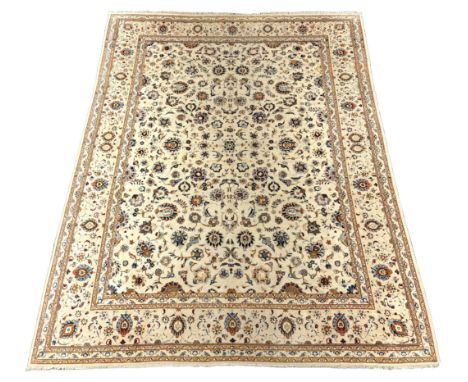 *A Kashan ivory ground carpet, central field of foliate motifs, multi bordered, 400 x 308cmPlease note this lot attracts an a