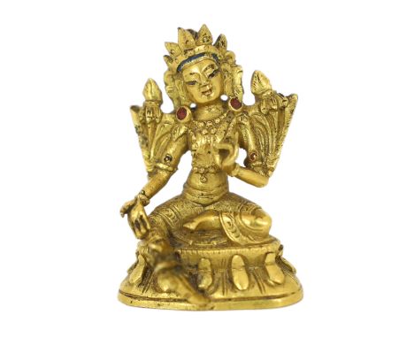 * A Tibetan miniature gilt bronze figure of Green Tara, 18th/19th century, 3cm highProvenance: G. Hawthorn Antiques, 22nd Oct