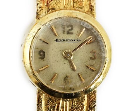 A lady's 18ct gold Jaeger LeCoultre manual wind wrist watch, with baton and quarterly Arabic numerals, case diameter 14mm,  o