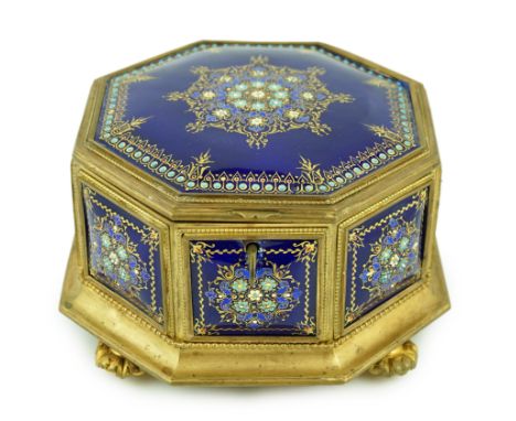 A 19th century French Limoges enamel casket, of octagonal form with jewelled floral decoration and foliate pad feet, 18cm wid