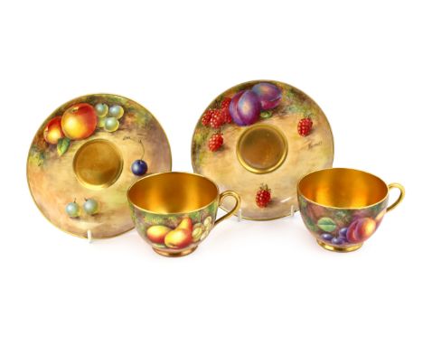A pair of Royal Worcester fruit painted tea cups and saucers, 1960s, the cups signed J. Smith and E. Townsend and the saucers