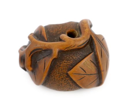 * A Japanese carved wood netsuke of a pumpkin with a stalk and leaves, 19th century, signed Tomonoru, 4.1cmProvenance: J. Hub