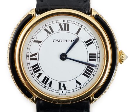 A lady's 18ct gold, black onyx and diamond set Cartier Vendome manual wind wrist watch, with Roman dial and case sides and wi