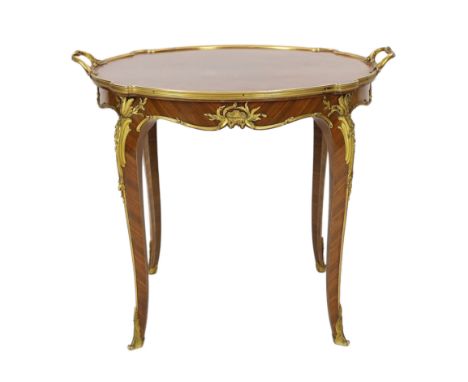 * * A late 19th century French ormolu mounted kingwood parquetry tray topped table, by Francois Linke, of serpentine circular