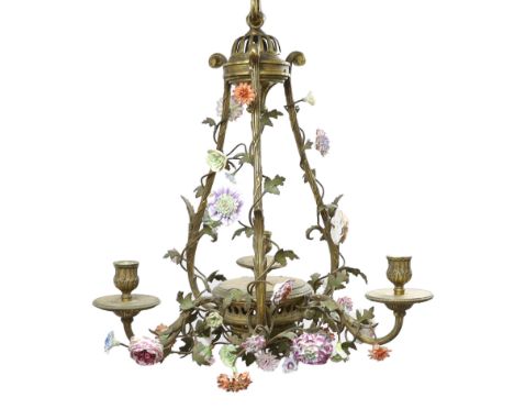*A Louis XVI style ormolu and porcelain three light chandelier with scrollwork frame, three reeded branches and floral encrus