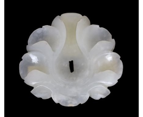 * A Chinese small white jade flower head, Song/Yuan dynasty, 12th/13th century, in the form of a hibiscus bloom, the centre c