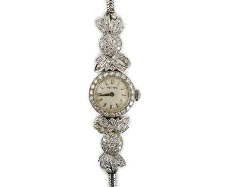 A lady's mid 20th century platinum and round cut diamond set Vertex manual wind cocktail watch, with baton numerals and diamo