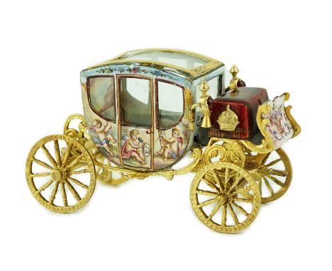 An early 20th century Viennese silver gilt and enamel miniature model of  carriage, by Ludwig Pollitzer? the panels painted w