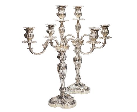 A good pair of late Victorian Elkington &amp; Co. silver twin branch, three light candelabra, of ornate scrolling design, Bir