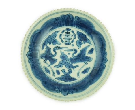 A Chinese blue and white ‘phoenix’ saucer dish, Jiajing mark and probably of the period, the centre painted with two phoenixe