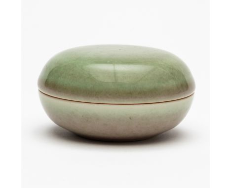 A CHINESE CELADON AND FLAMBE GLAZED PORCELAIN INK BOX AND COVER (2)Blue six character Kangxi mark but later, 7cm diameterGood