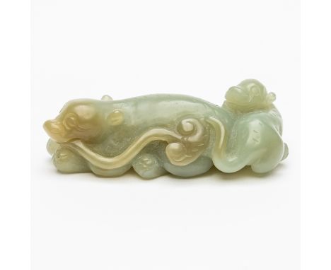 A CHINESE CEALDON JADE CARVING OF A RECUMBENT CAT WITH KITTEN19th/20th century The adult holding a sprig of lingzhi in its mo